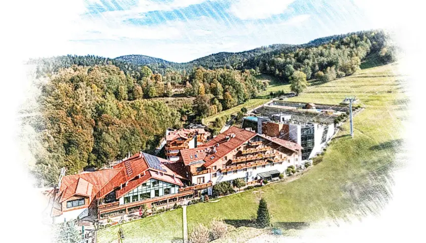 Malowniczy hotel meta w otoczeniu jesiennych lasów i zielonych wzgórz. Widok z lotu ptaka na architekturę i krajobraz.